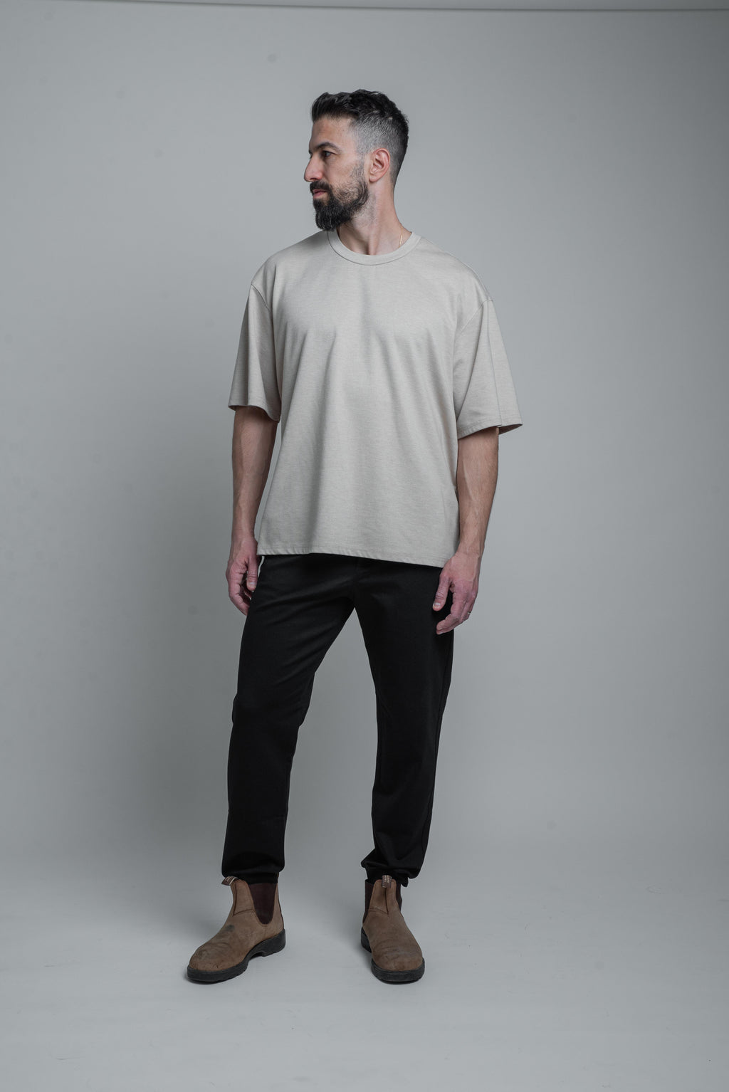 a model wearing black armato pants