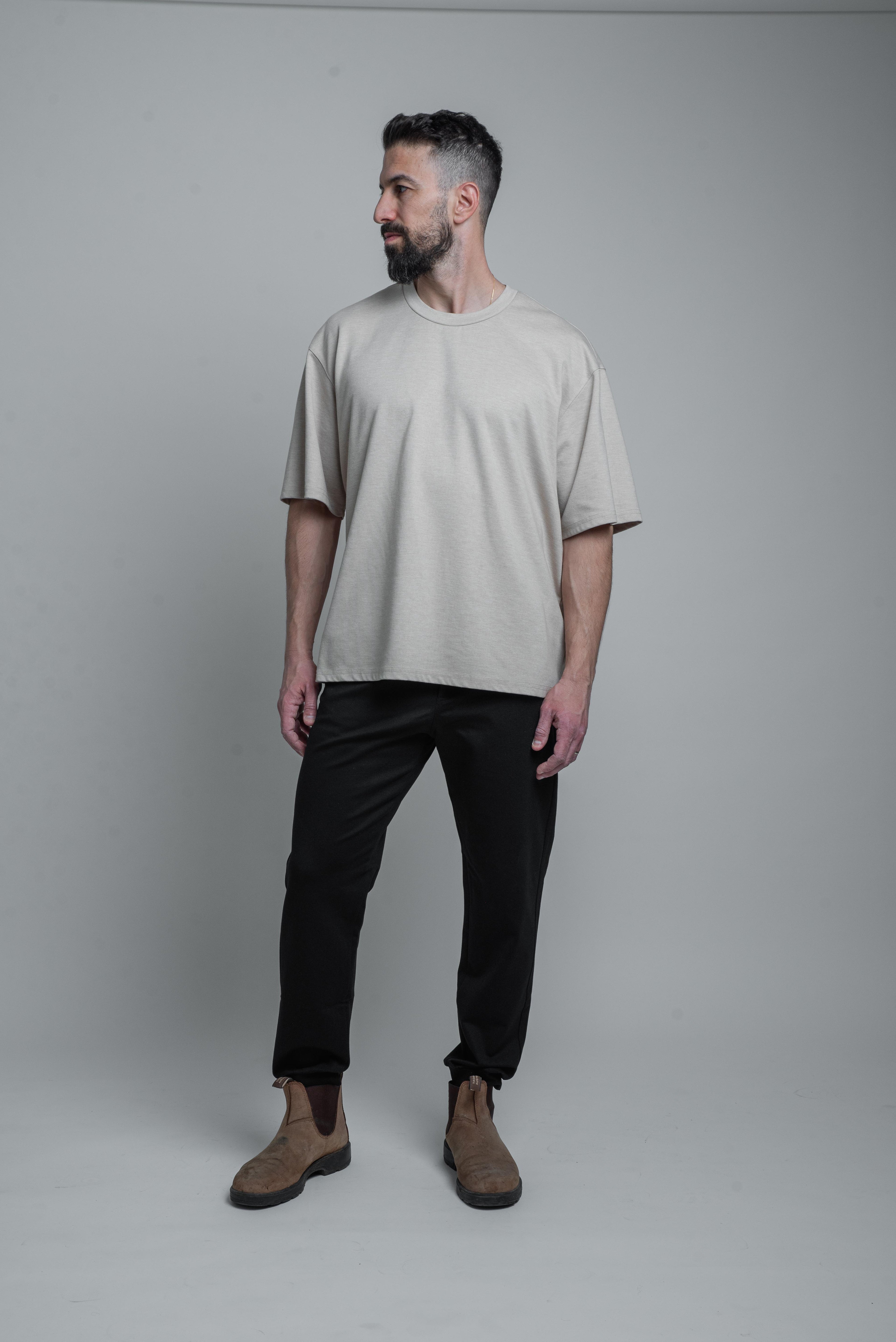 a model wearing black armato pants