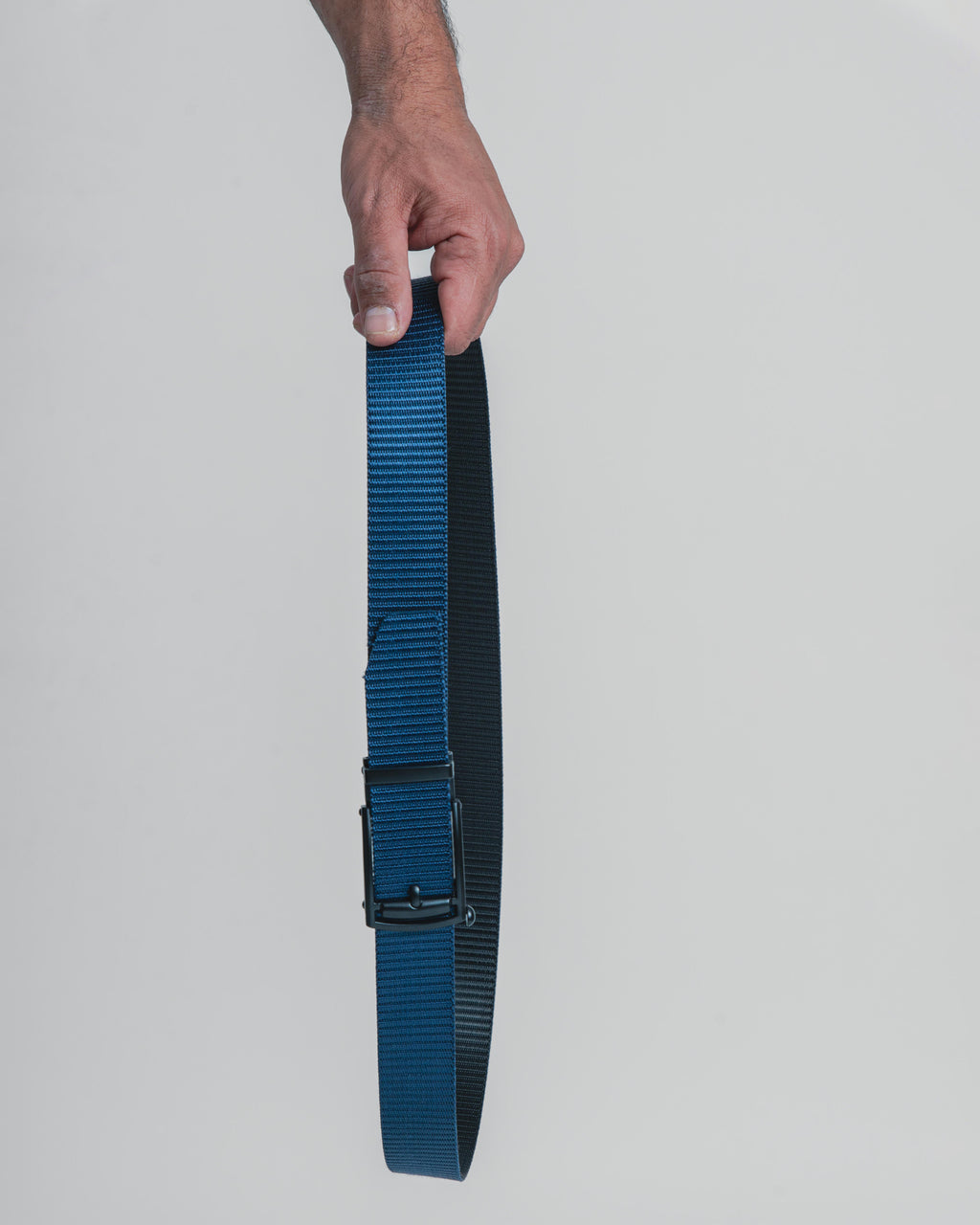 hand holding belt